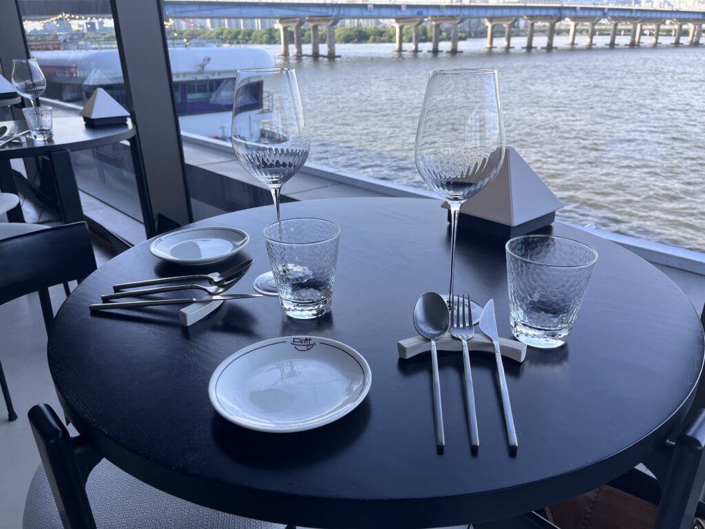 Elegant restaurant table setting with a Han River view in Seoul